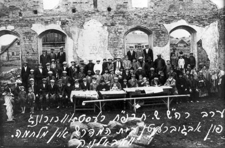 The Jews of Vabalninkas, Lithuania, in front of one of the torched synagogues in the town, on the eve of Rosh Hashana 1927