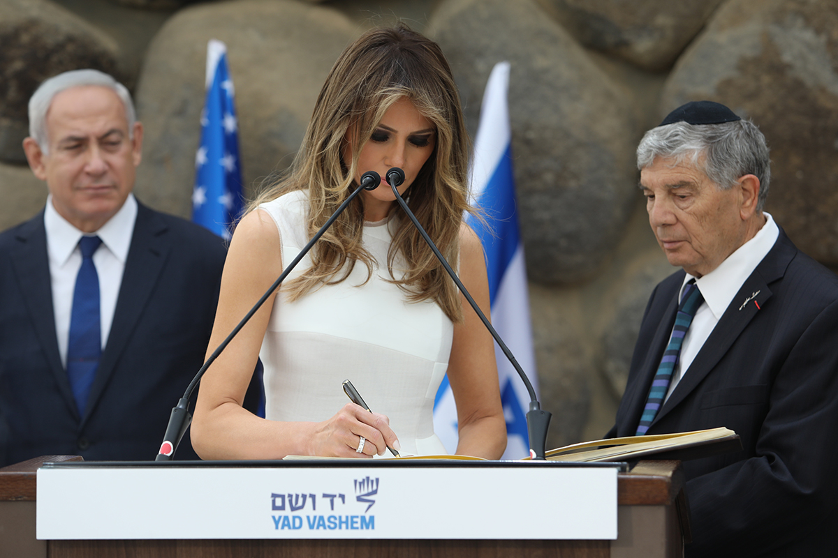 First Lady of the United States Melania Trump signing the Yad Vashem guestbook.