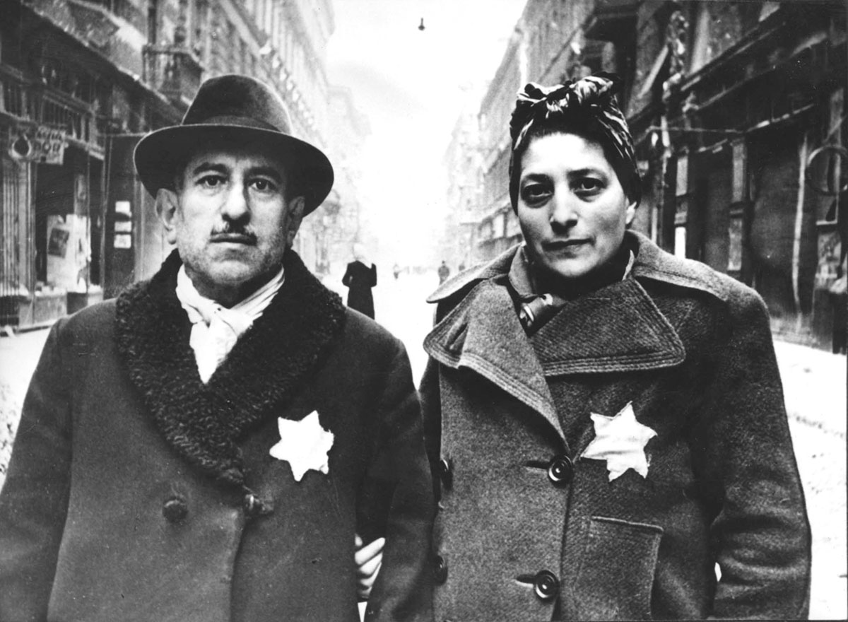 A couple wearing Jewish badges, Budapest, Hungary, January 1945. Photographer: Evgeni Khaldei