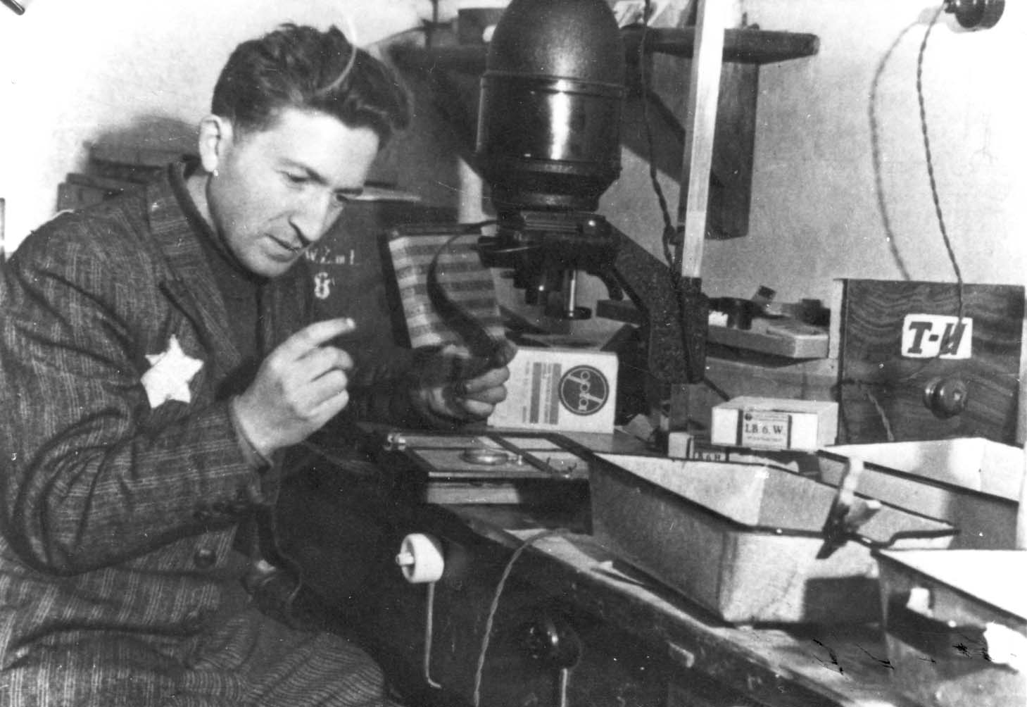 The photographer Mendel Grossman in his laboratory in the Lodz Ghetto, Poland