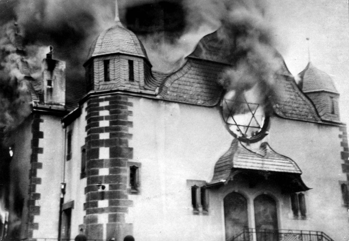 Flames pouring out of a synagogue in Siegen, Germany, during Kristallnacht, November 9/10, 1938