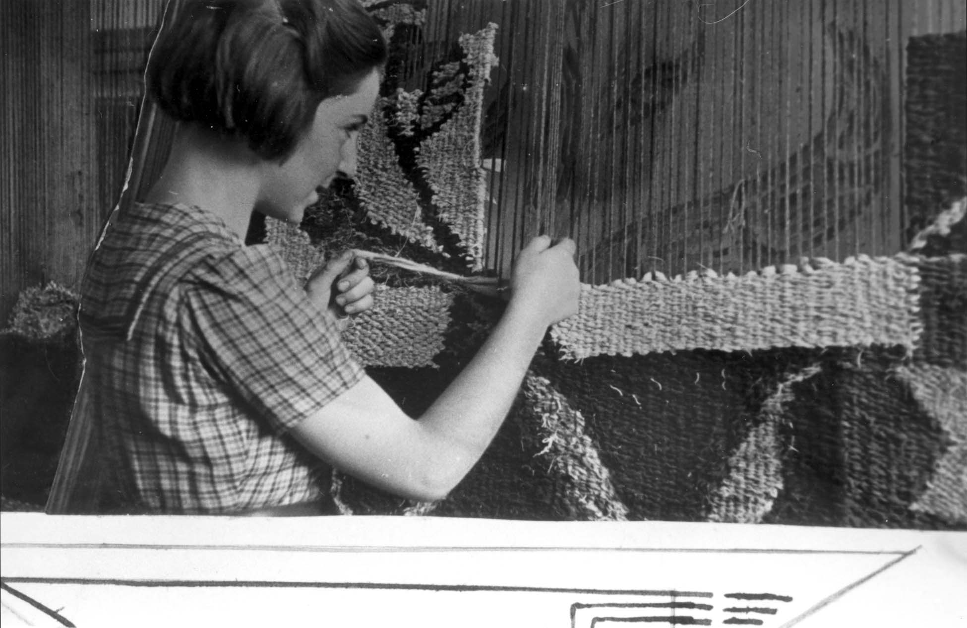 Girl weaving in a Lodz ghetto factory