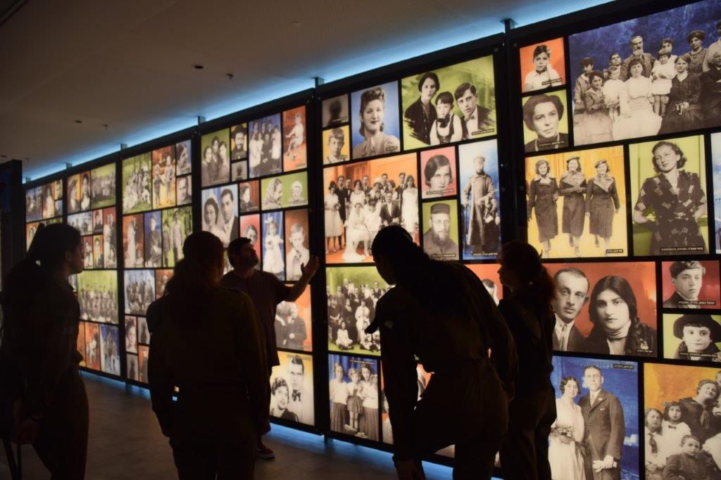 Group of IDF soldiers viewing photos from before the Shoah on display in the Yad Vashem's new Center in the Negev