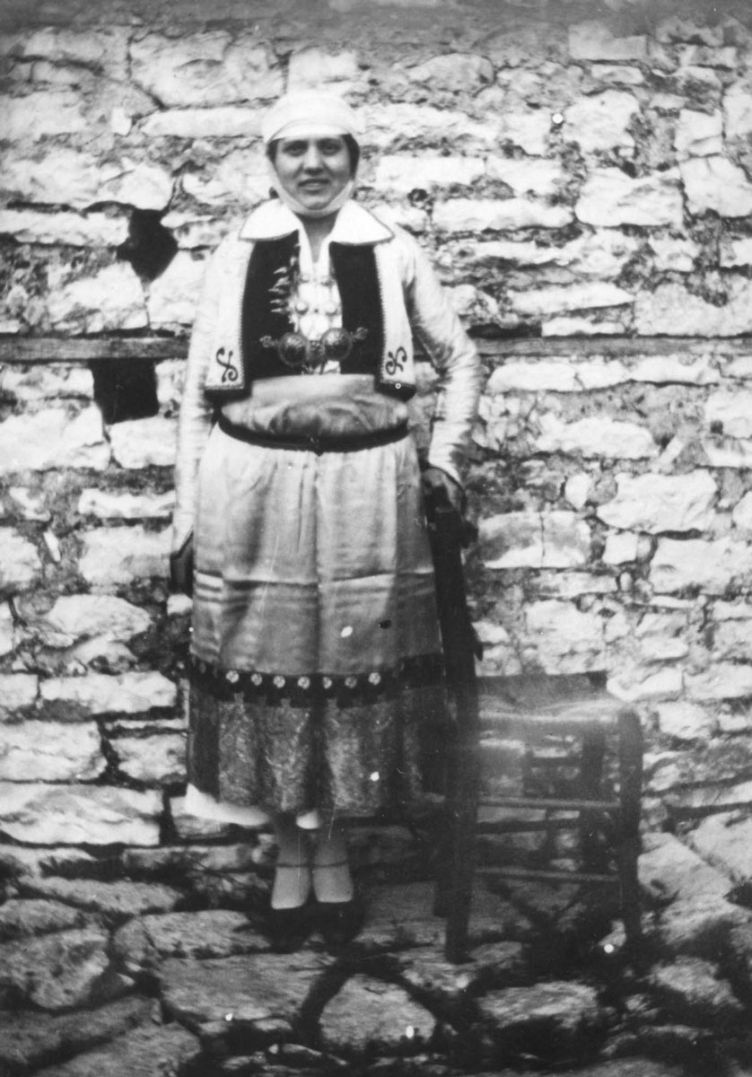 Eftihia Batis wearing the traditional dress of the villages in the Epirus region, whose capital is Ioannina. Epirus, Greece, 1930s.