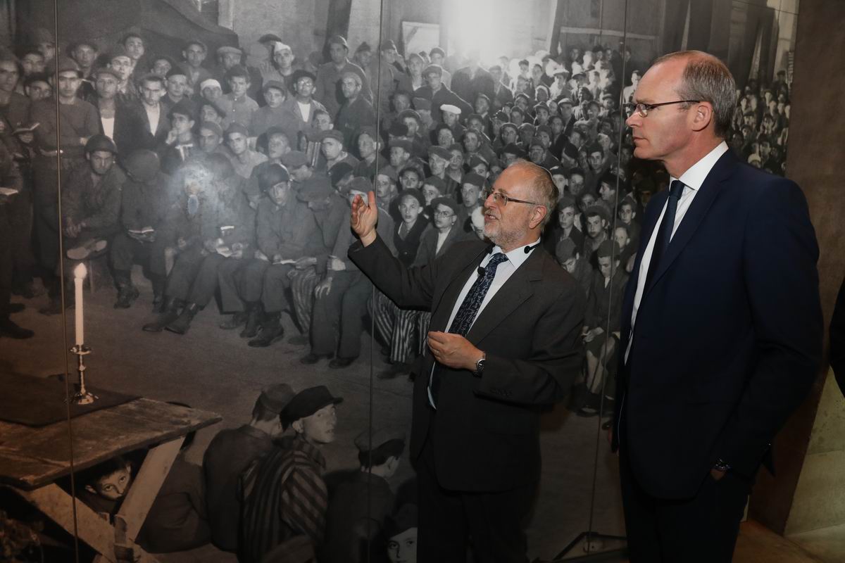 Irish Foreign Minister Simon Coveney (right) at the exhibit on liberation in the Holocaust History Museum