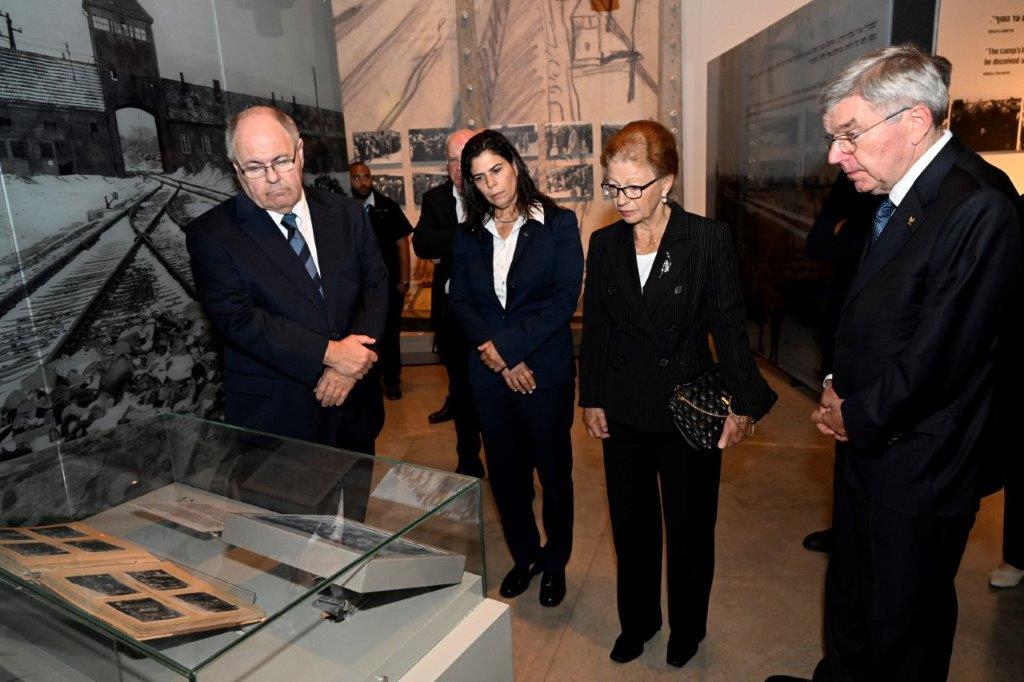 Thomas Bach views the Auschwitz Album on display in the Holocaust History Museum