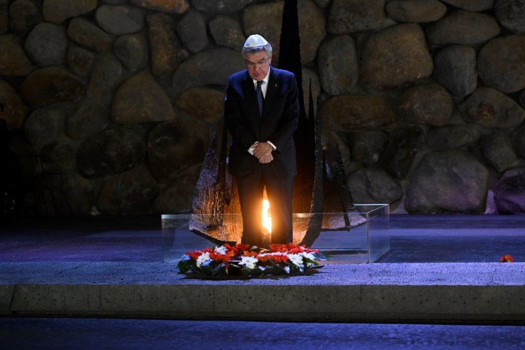 International Olympic Committee President Thomas Bach lays a wreath during the memorial ceremony on the Hall of Remembrance