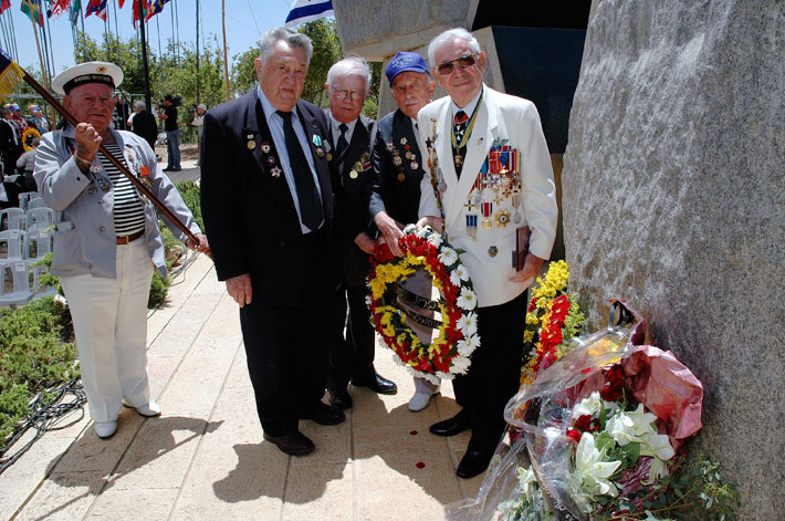 Veterans lay a wreath during the ceremony