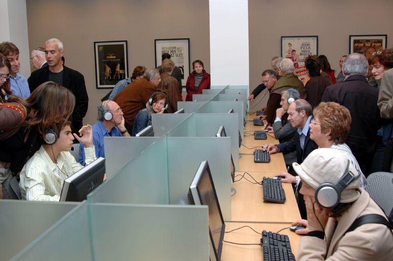 Visitors accessing the film database in the Visual Center