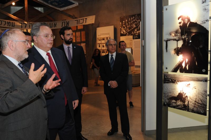 Greek's Foreign Minister Nikolaos Kotzias (second from left) was guided through the Holocaust History Museum by Director of the Yad Vashem Libraries Dr. Robert Rozett