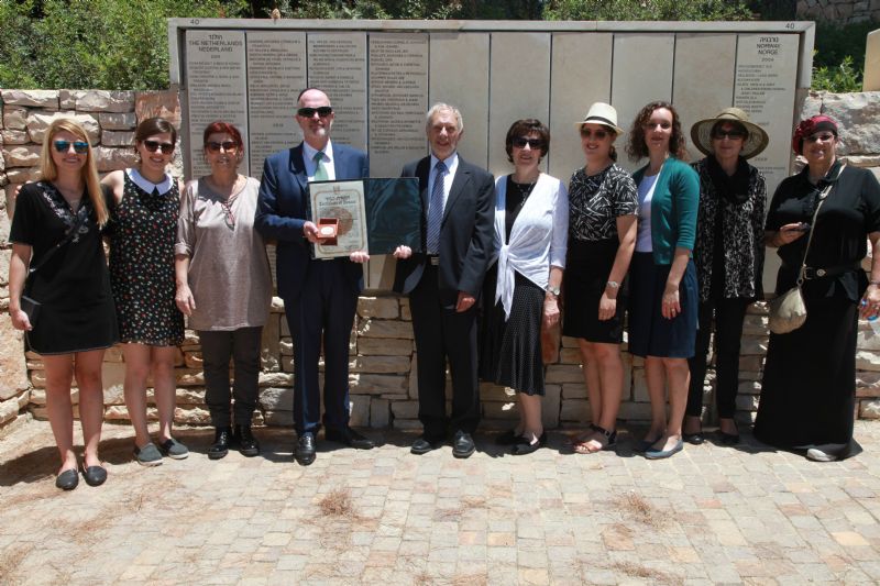The extended Vink and Loewenstein families gather in the Garden of the Righteous Among the Nations following an emotional ceremony in Yad Vashem's Synagogue.