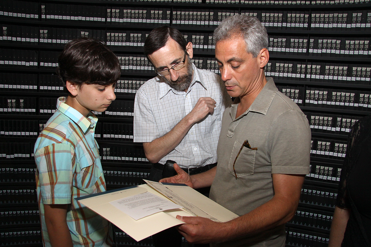 Rahm Emanuel and his son Zach with Hall of Names Director, Alexander Avram, in the Hall of Names, Yad Vashem