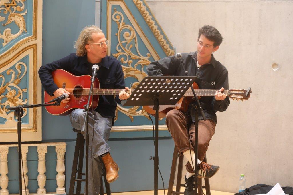 Omri and Yoav Dolev, grandson and great-grandson of Righteous Among the Nations Dr. Jacob Boon, play a musical piece during the recognition ceremony 