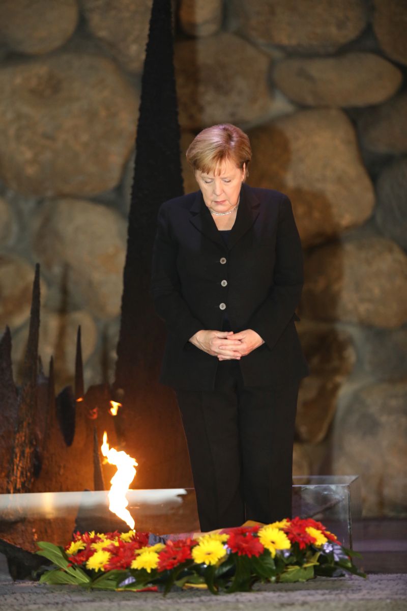 The German Chancellor rekindled the eternal flame and laid a wreath during a memorial ceremony in Yad Vashem's Hall of Remembrance