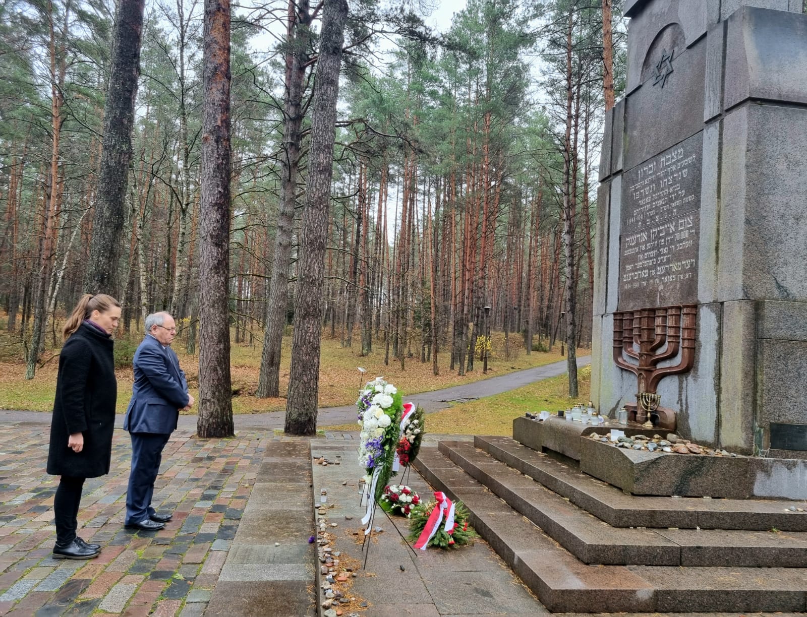 Yad Vashem Chairman Dani Dayan accompanied by Deputy Speaker of the Seimas Radvilė Morkūnaitė-Mikulėnienė lays a wreath at the memorial site in the Ponary Forest