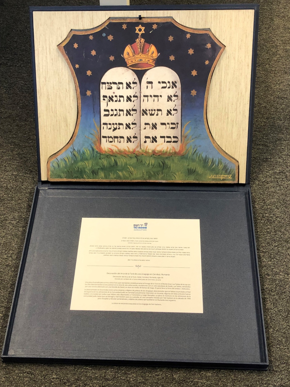 A replica of a colorful synagogue painting depicting the Tablets of the Covenant that once adorned a Torah Ark in Cernăuți, Romania, presented to His Holiness Pope Francis by Yad Vashem Chairman Dani Dayan during his private audience at the Vatican