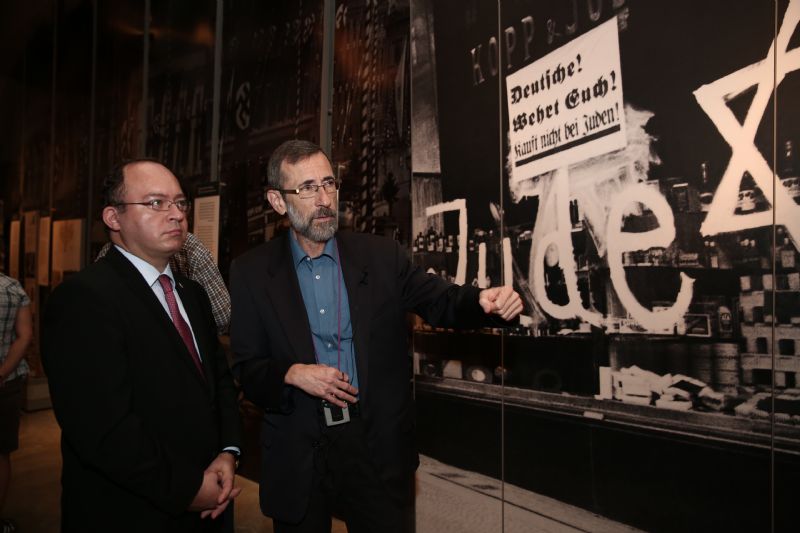Minister Bogdan Aurescu, Foreign Minister of Romania (left), is guided through the Holocaust History Museum by Dr. Alexander Avram, Director of the Hall of Names 

