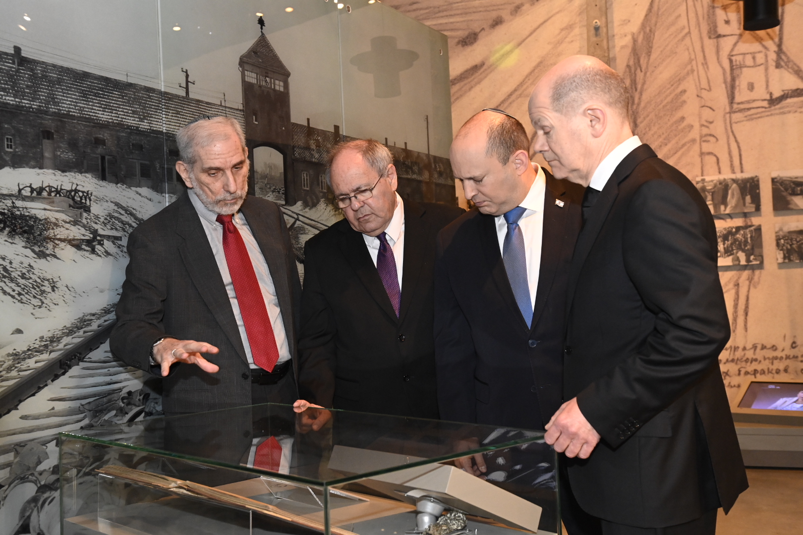 Chancellor Scholz views the Auschwitz Album, which documents the arrival of transports of Hungarian Jews to the infamous death camp in the summer of 1944.