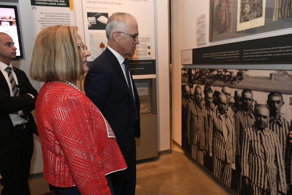 Prime Minster Turnbull and his wife Lucy studying a picture of prisoners at the Auschwitz-Birkenau extermination camp in the Holocaust History Museum 