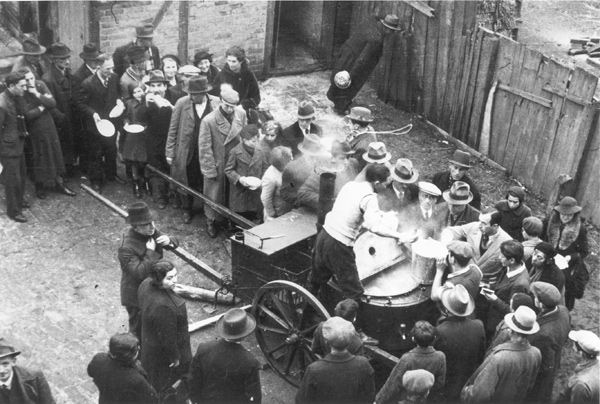 Deported Jews on line for soup at a public kitchen established for refugees, Zbąszyń, Poland, November 1938
