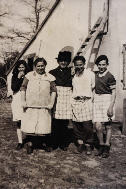 Pujaudran, France, A photograph of the Rudel family in the midst of baking Matzos, 1943. See some of Claudine Rudel's recollections.