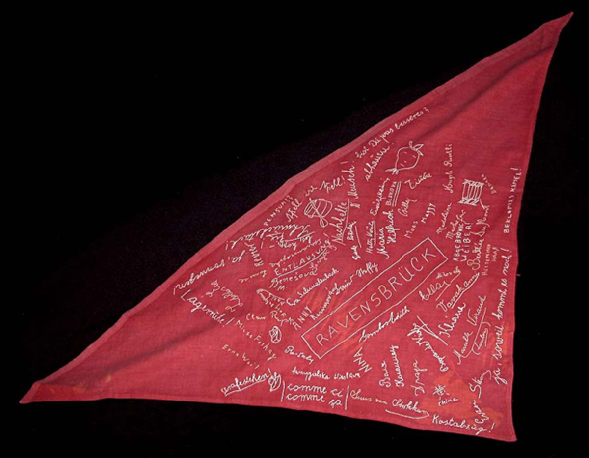 Strip of cloth left over from a Nazi flag, signed by women prisoners in Ravensbrück. Yehudit Aufrichtig embroidered their signatures