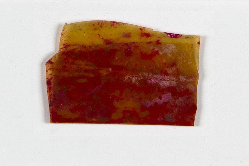 The remainder of a piece of rouge preserved in a celluloid scrap that enabled Rosa Sperling and her daughter Marila to pass the selections in the camps