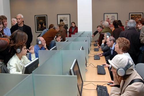 Visitors view films at personal computer stations at the official opening of the Visual Center, 1.11.05
