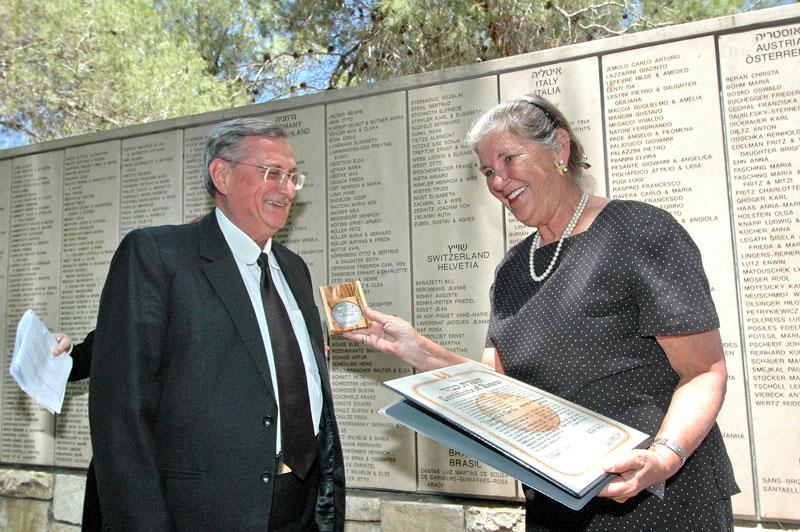 The Sharps’ daughter, Martha Sharp Joukowsky receives the medal and certificate from Justice Turkel, the Chairman of the Commission for the Designation of the Righteous 