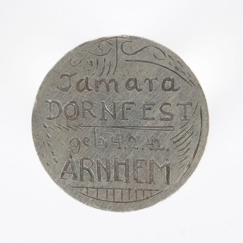 Medallion engraved with the name of Tamara Dornfest, born in the Netherlands on 4 February 1942 and murdered in Auschwitz-Birkenau in 1944