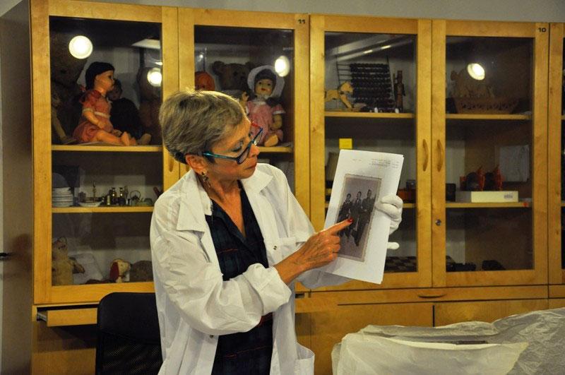 Haviva tells the story of Stella Knobel in the collection room, Yad Vashem