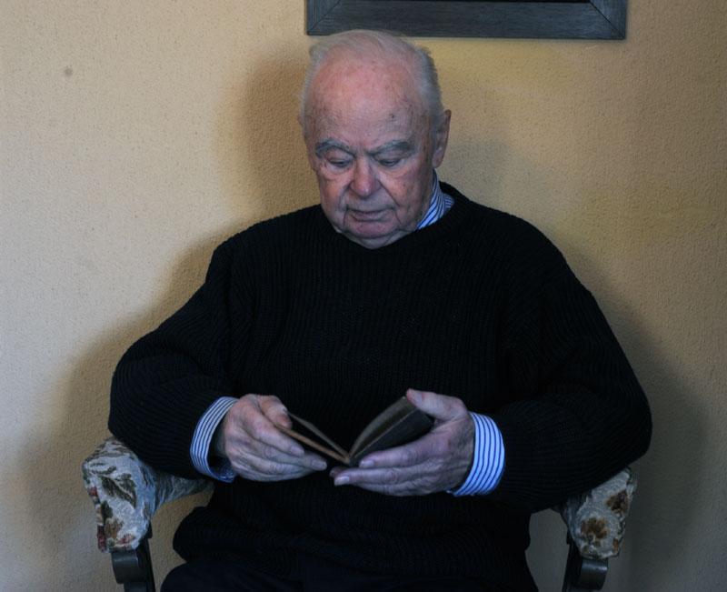 Alexander in his home when he donated the notebook to Yad Vashem