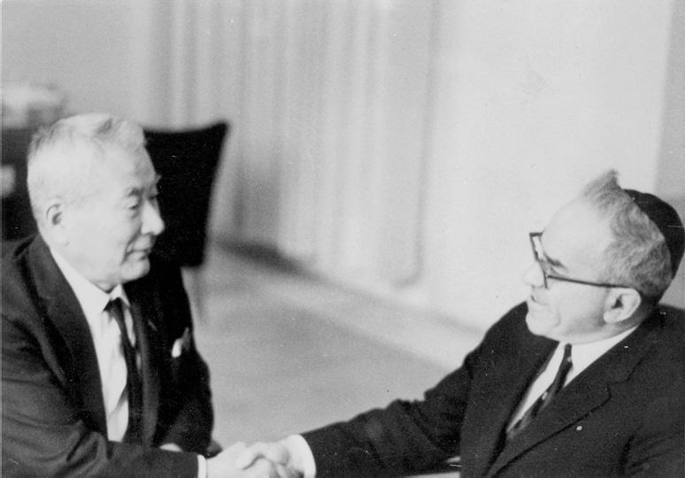 Sugihara (left) meets with Zerah Warhaftig after the war