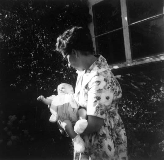 Wiktoria holding Eva’s first born, Heni, summer 1960