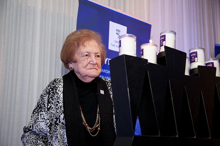 Holocaust survivor Sabina Miller lit a memorial candle