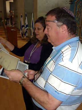 Mark Goldstein, Executive Director the Jewish Federation of the Lehigh Valley, PA, reviews documents about his father, a Holocaust survivor, presented to him from Yad Vashem's archives. Israel Community Mission to Israel visit to Yad Vashem, October 2012