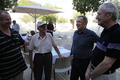 Right to left: Journalist Daniel Peer; Avraham Harshalom &amp; guests