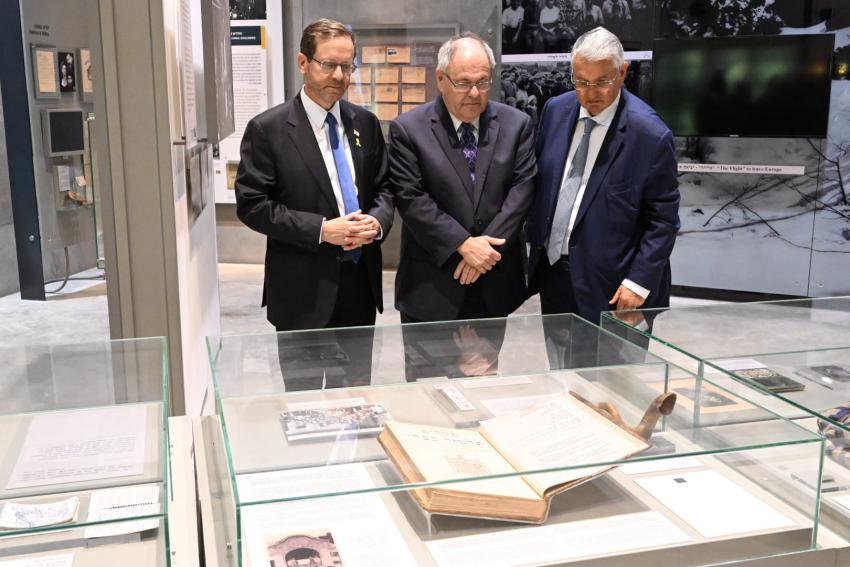 (L-R) President of Israel Isaac Herzog, Yad Vashem Chairman Dani Dayan and Head of the Swiss Friends of Yad Vashem Yoel Herzog, brother of the President, in the Holocaust History Museum at Yad Vashem