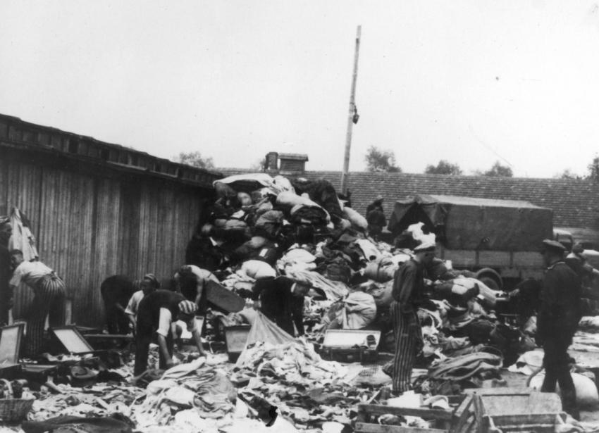 Photo 30: Sorting stolen personal items outside the barracks