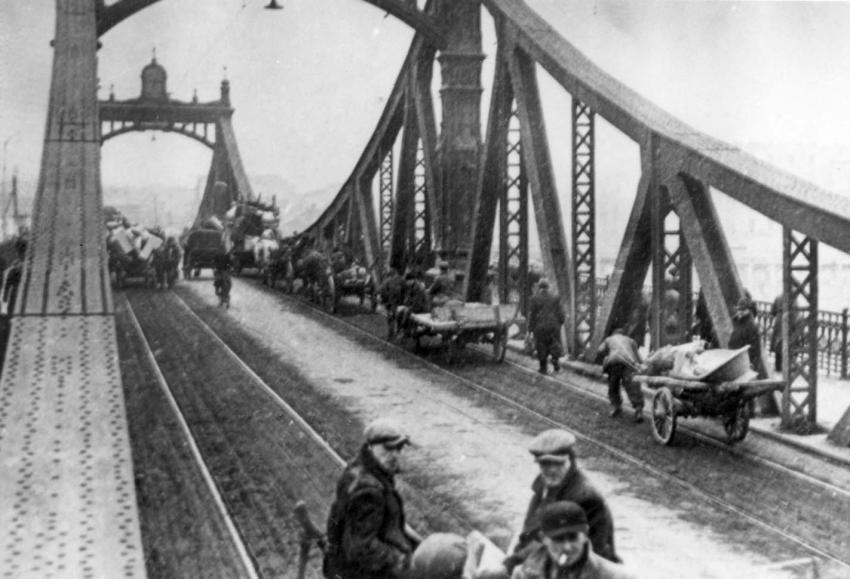Jews crossing the tram bridge on their way to the ghetto, 1941