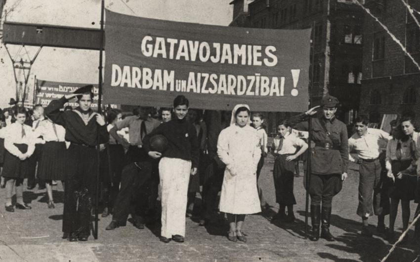 Liepaja, Latvia under Soviet rule, 1 May 1941. Standing left, saluting: Jascha Izakson, son of a Jewish father and a Latvian mother. Jascha's father was murdered in the Holocaust; Jascha survived.