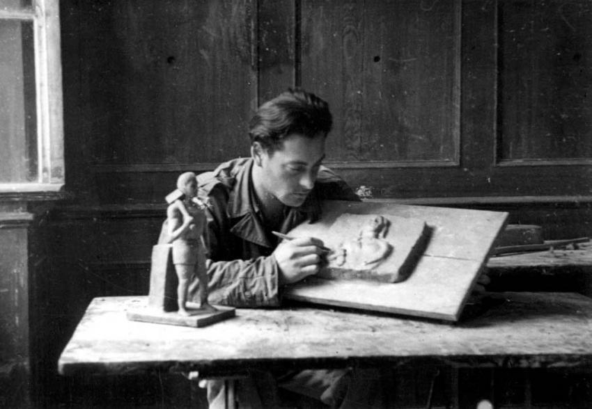 A sculptor at work in a DP camp, Germany, postwar