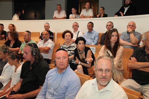 Dr. Robert Rozett, Director of The Libraries at Yad Vashem (right front) &amp; guests at the Synagogue of Yad Vashem