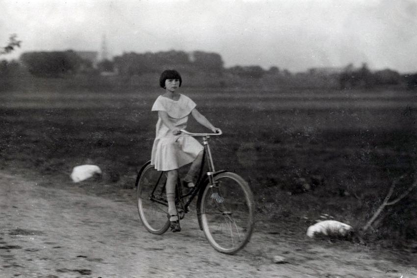 Atara Kudlanski rides a bicycle, Eishishok, Poland, October 30, 1930
