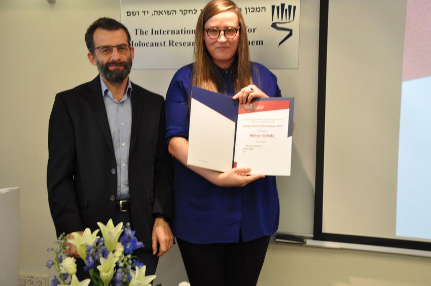 Miriam Schultz receiving a prize, with Dr. Arkadi Zeltser