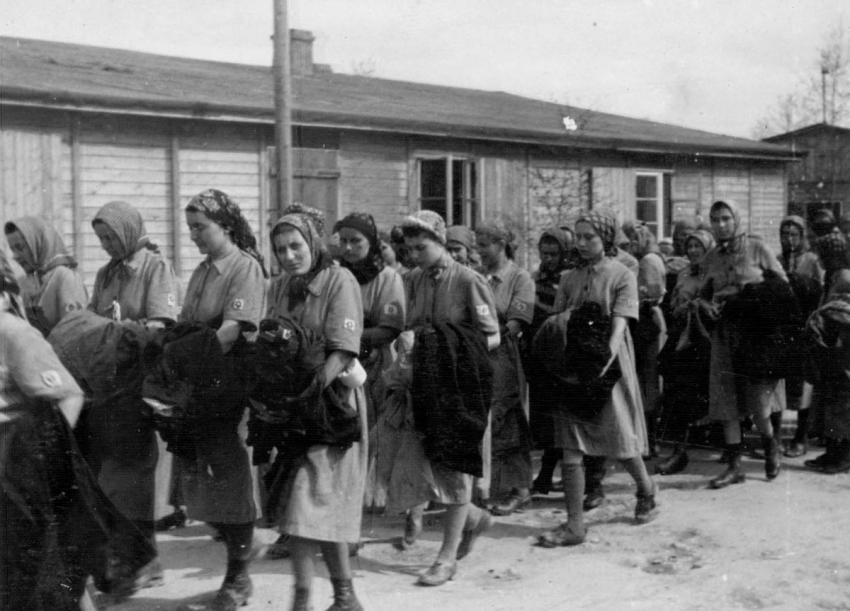 Photo 22: Jewish female prisoners who have been selected for forced labor are marched to a different section of the camp