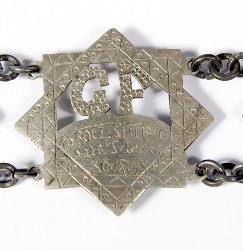 Bracelet found in the liquidated Lodz ghetto, engraved with depictions of life in the ghetto and the date 30 September 1943