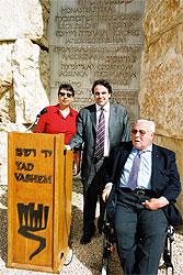 RTL: Director of the French, Benelux, and Scandinavian Desk at Yad Vashem, Miri Gross; Joel Mergui; and Jean Kahn in the Valley of the Communities. The wall behind them bears the names of the French Jewish communities that fell victim to the Holocaust