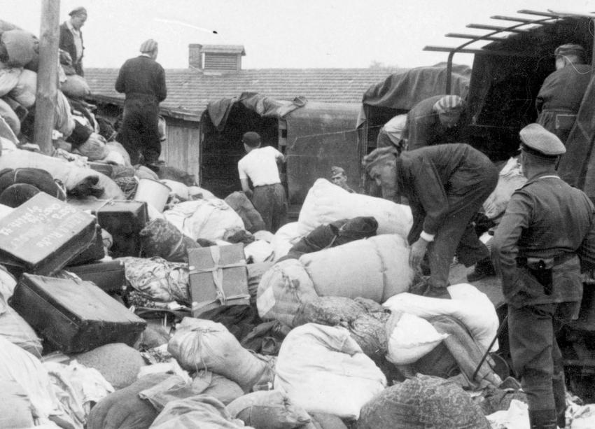 Photo 28: The barracks in the “Kanada” section were insufficient and a large amount of stolen personal items filled the space between the barracks