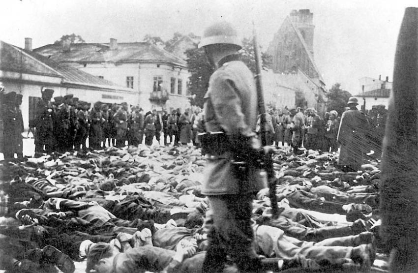 German policemen guarding men forced to lie on the ground on &quot;Bloody Wednesday&quot; in Olkusz, Poland, 31/07/1940